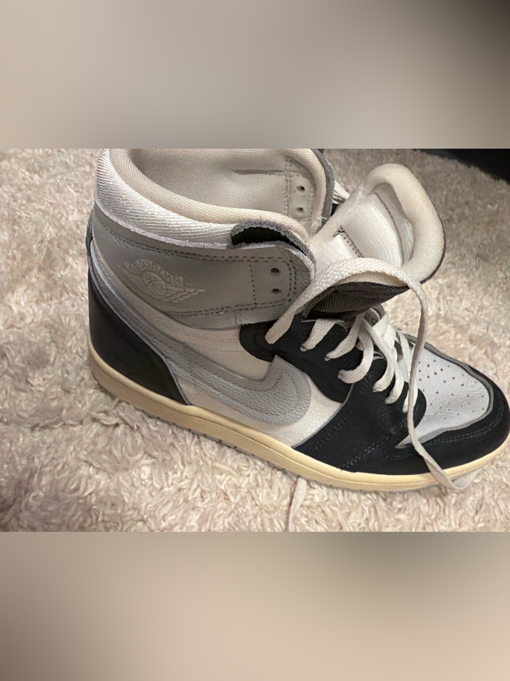 Jordan Women's High-Top Sneaker in White and Black